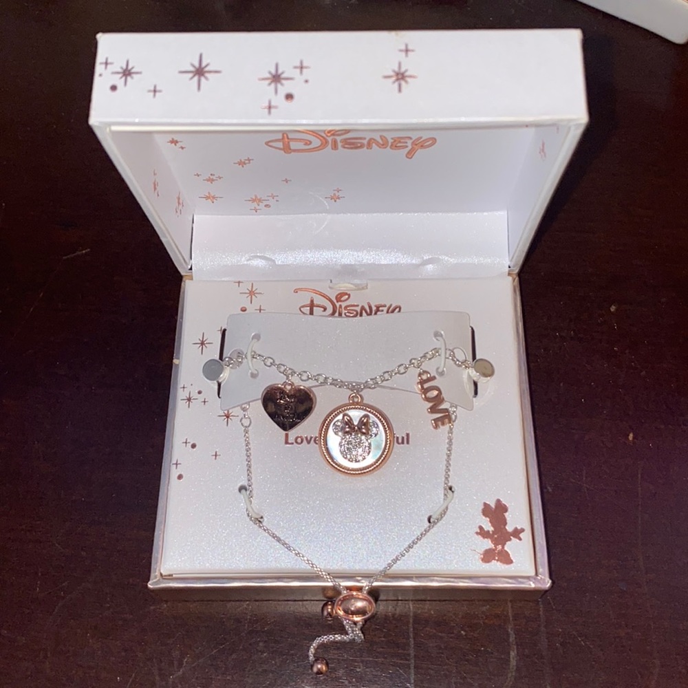 Rose gold Minnie Mouse bracelet.